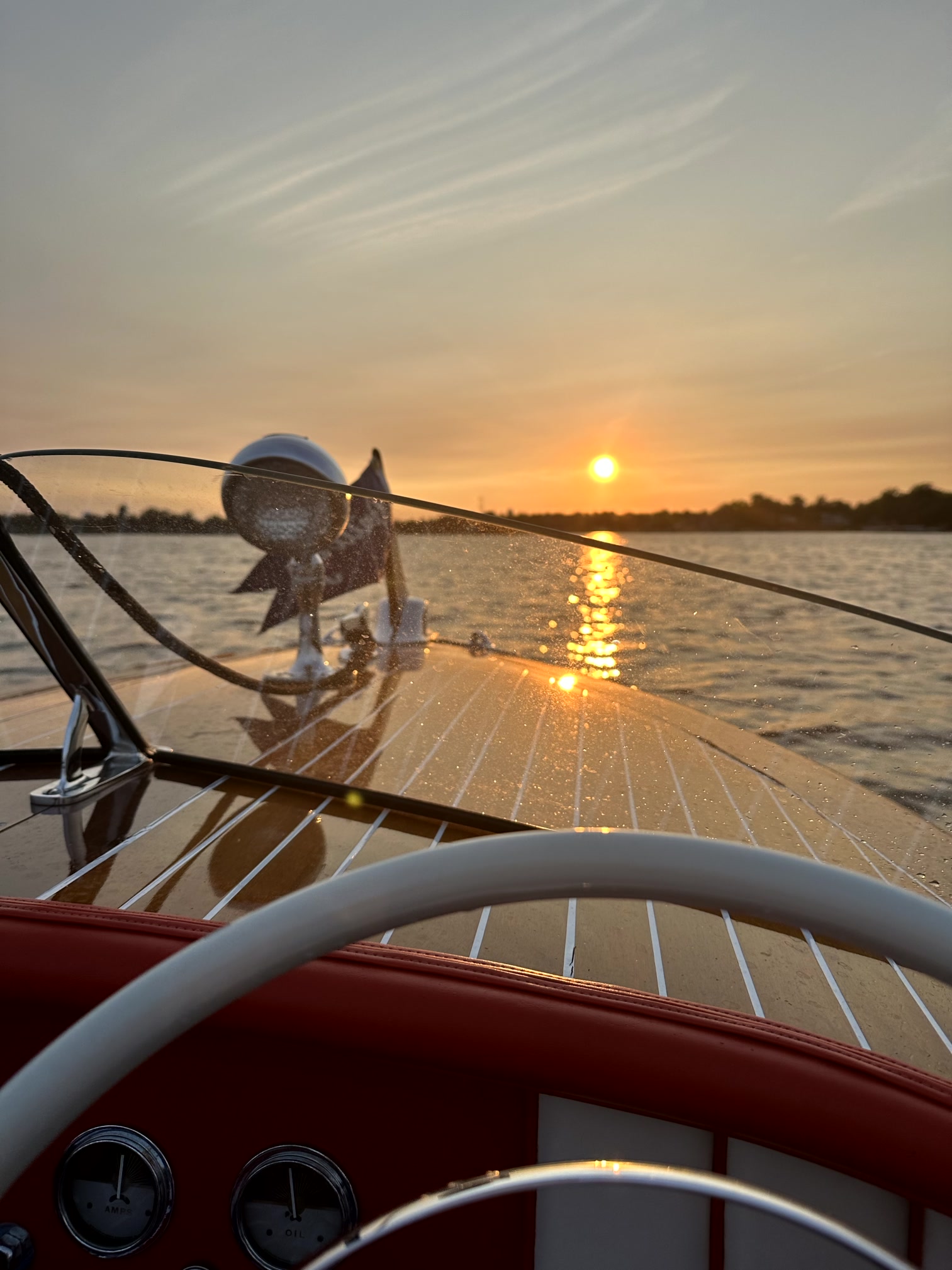 View from a classic wooden boat at sunset