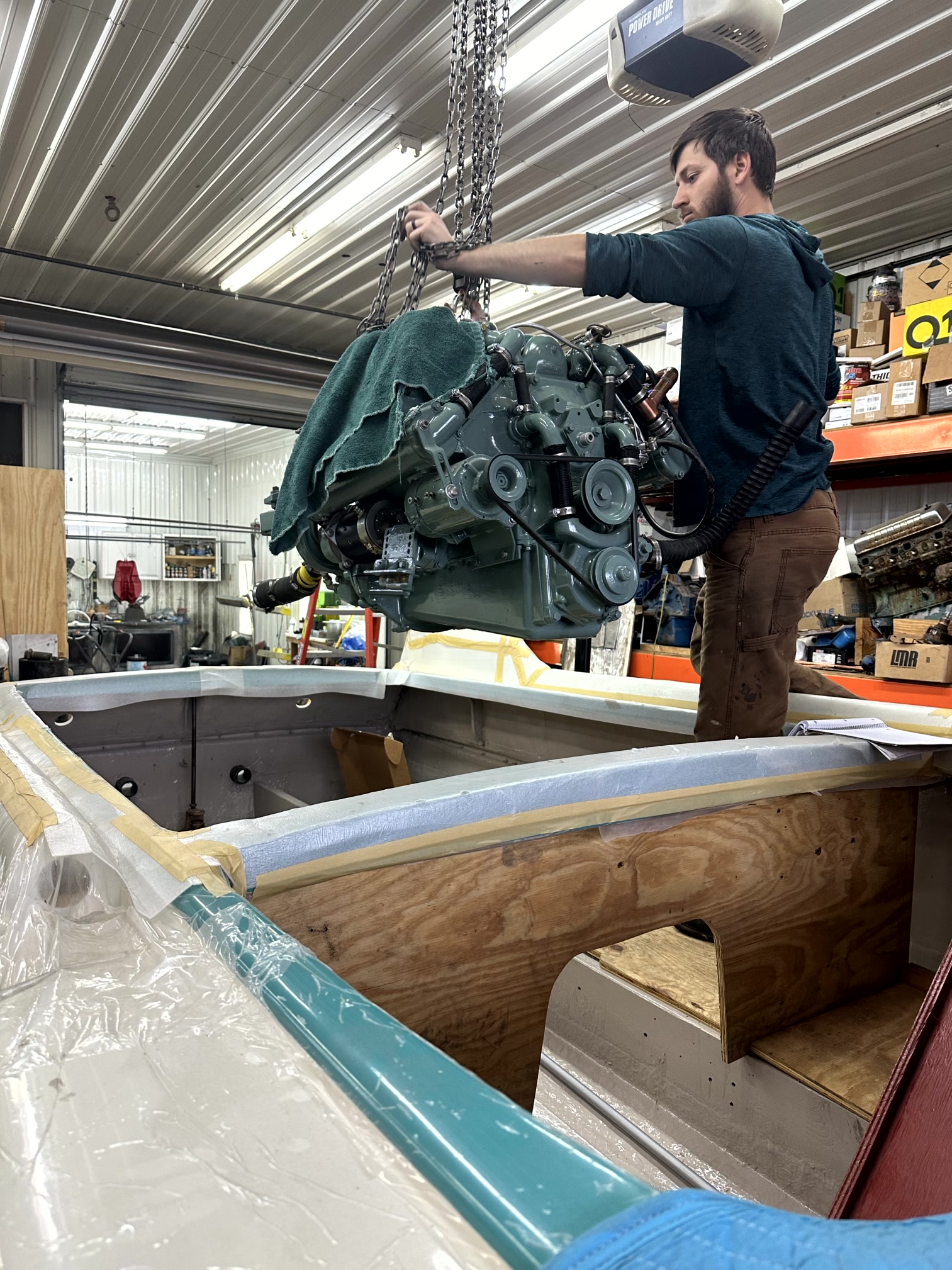 Paul McCoy working on an engine during a classic boat restoration