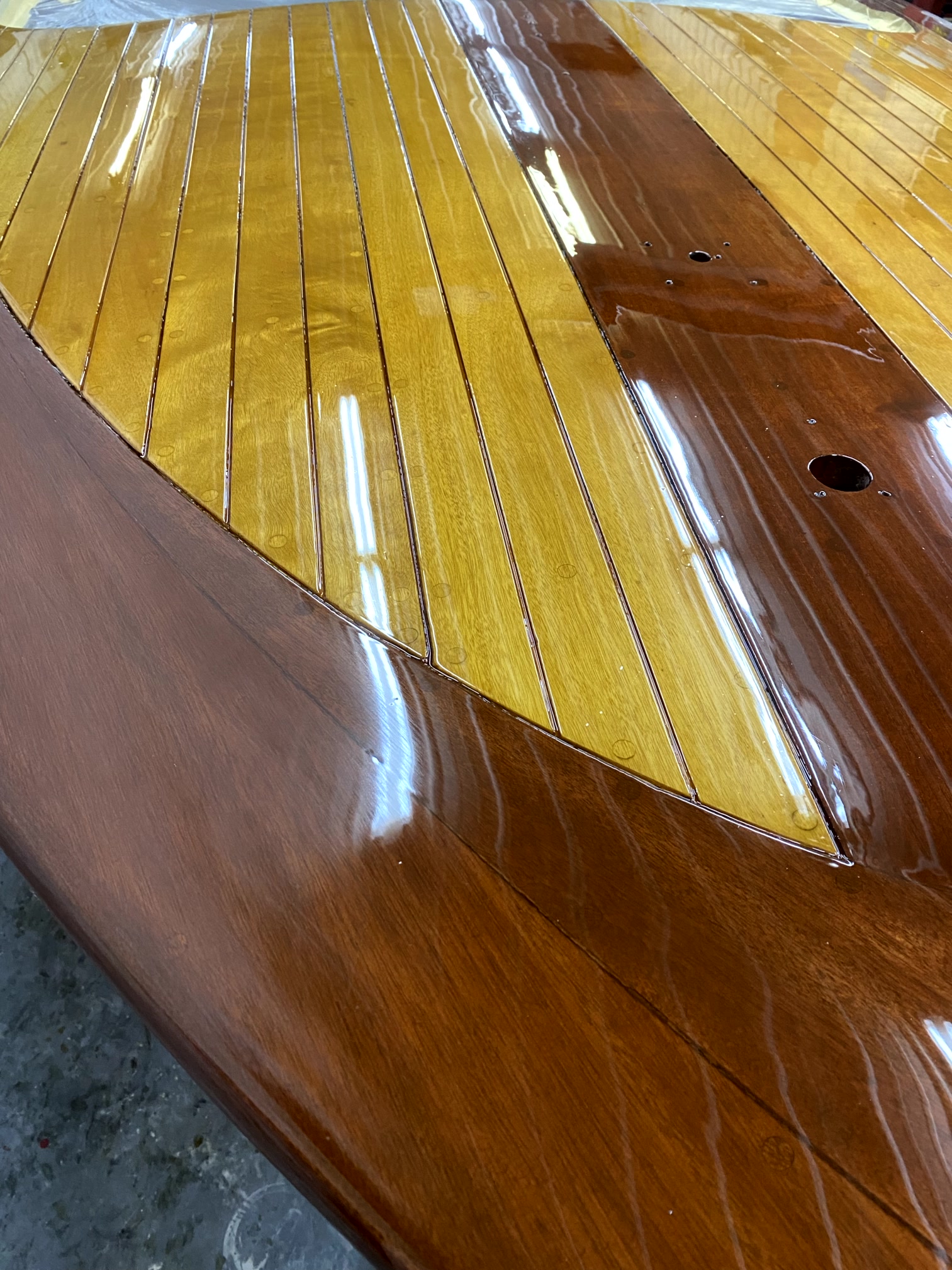 Varnished deck on a restored classic wooden boat